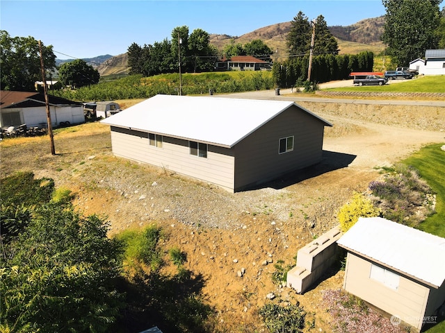 view of side of property featuring a mountain view