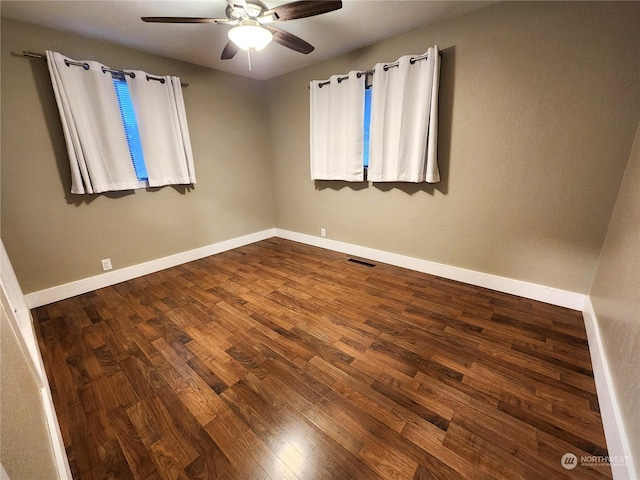 empty room featuring wood-type flooring and ceiling fan