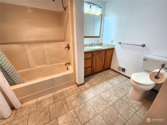 full bathroom with shower / bath combination with curtain, vanity, and toilet