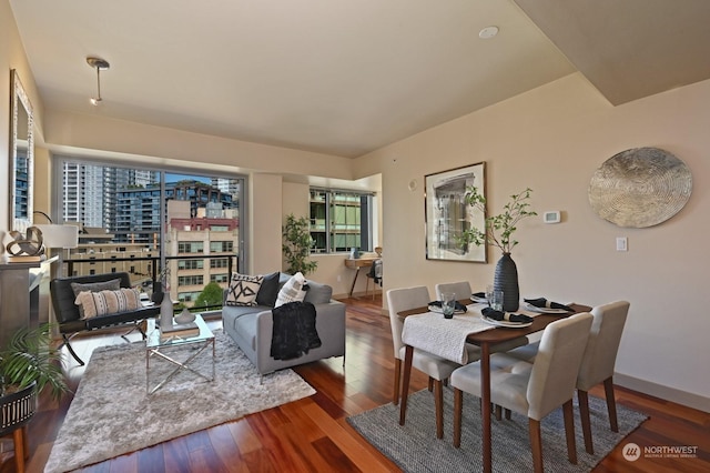 living room with dark hardwood / wood-style flooring and plenty of natural light