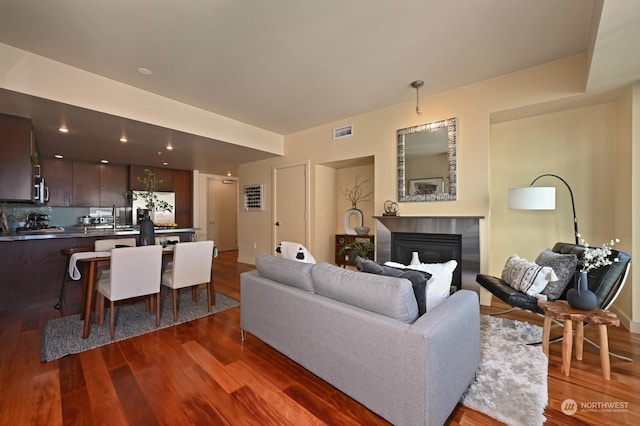 living room featuring dark hardwood / wood-style flooring