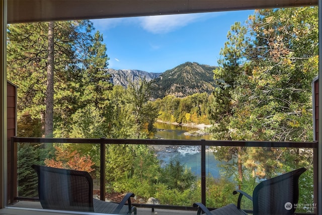 balcony with a water and mountain view