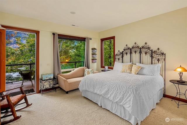 carpeted bedroom with access to exterior