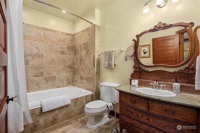 full bathroom featuring shower / bathtub combination with curtain, toilet, and vanity