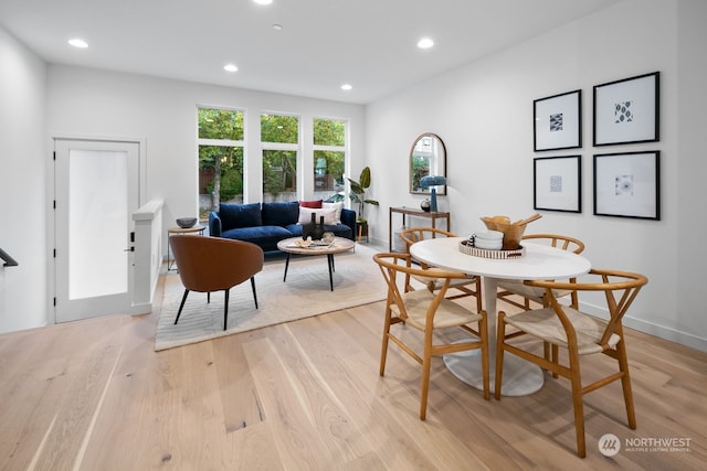 dining area featuring light wood-type flooring