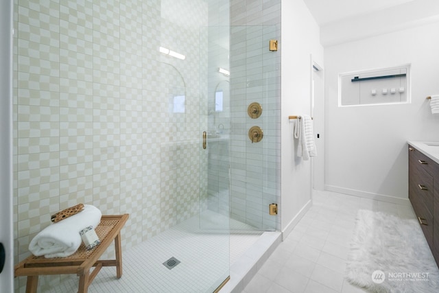 bathroom with vanity, tile patterned floors, and walk in shower