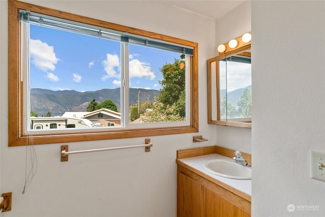 bathroom featuring oversized vanity and a mountain view