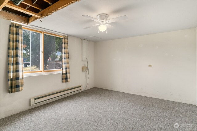 carpeted empty room featuring baseboard heating, plenty of natural light, and ceiling fan