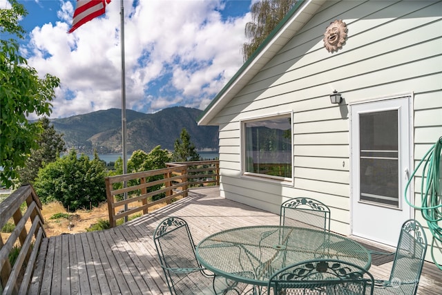 wooden deck featuring a mountain view