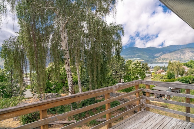 wooden terrace featuring a mountain view