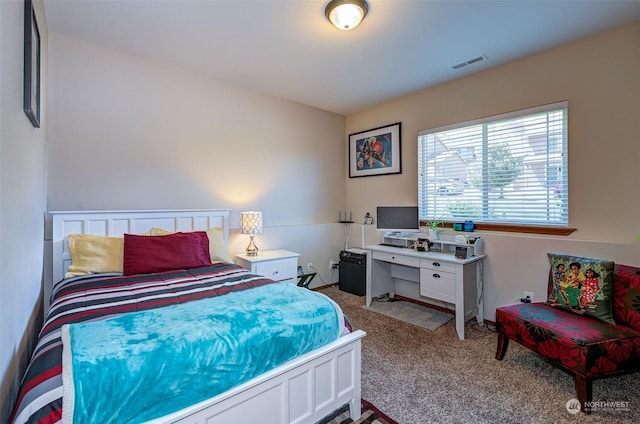 bedroom featuring light colored carpet