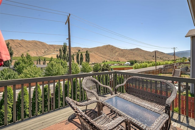 wooden terrace featuring a mountain view