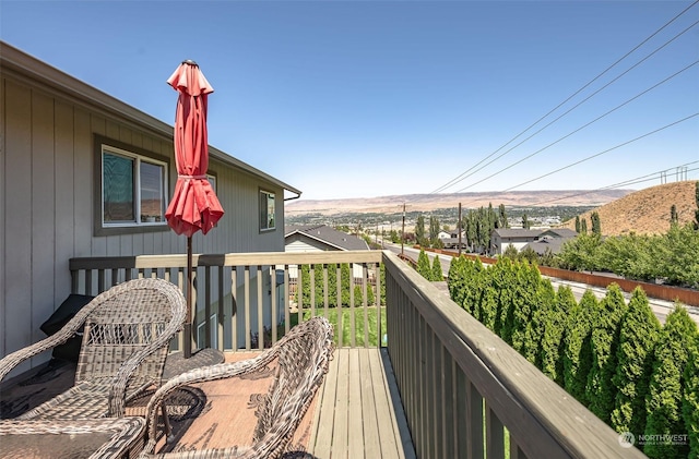 balcony featuring a deck with mountain view