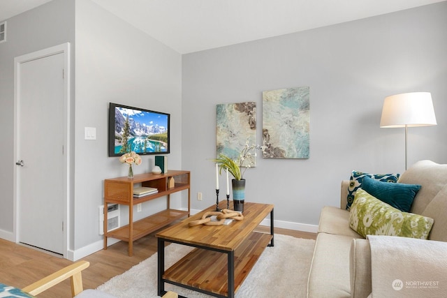 living room with light hardwood / wood-style floors