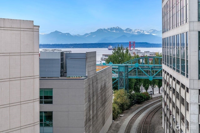 exterior space featuring a water and mountain view