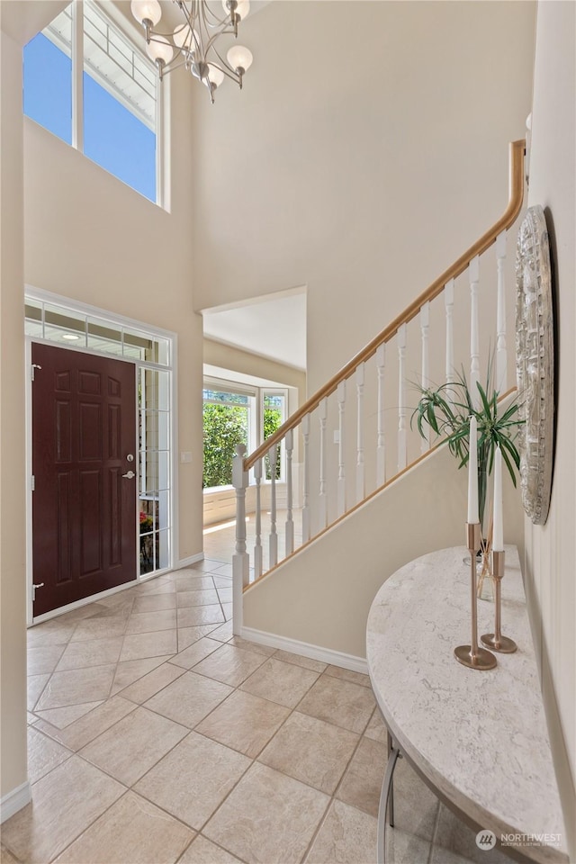 3377 Topaz Ct, Bellingham, WA 98226 - tiled foyer entrance featuring stairway, a chandelier, and a towering ceiling