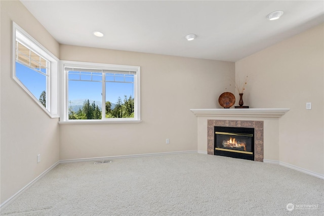 3377 Topaz Ct, Bellingham, WA 98226 - unfurnished living room with a tiled fireplace, carpet, and recessed lighting