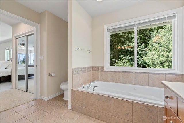 bathroom with tile patterned floors, plenty of natural light, and toilet