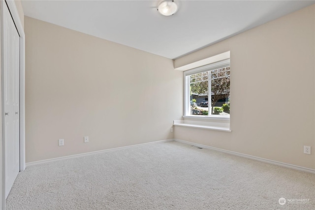 empty room featuring carpet floors