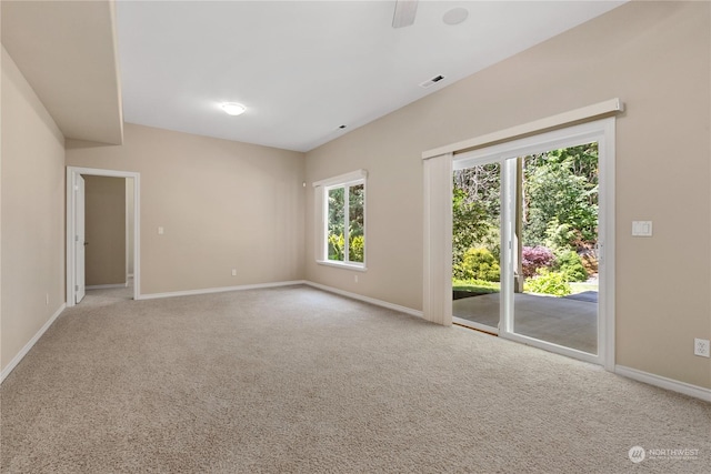 empty room with ceiling fan and light colored carpet