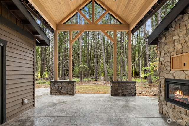 view of patio / terrace featuring an outdoor stone fireplace