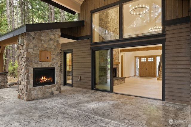 view of patio featuring an outdoor stone fireplace