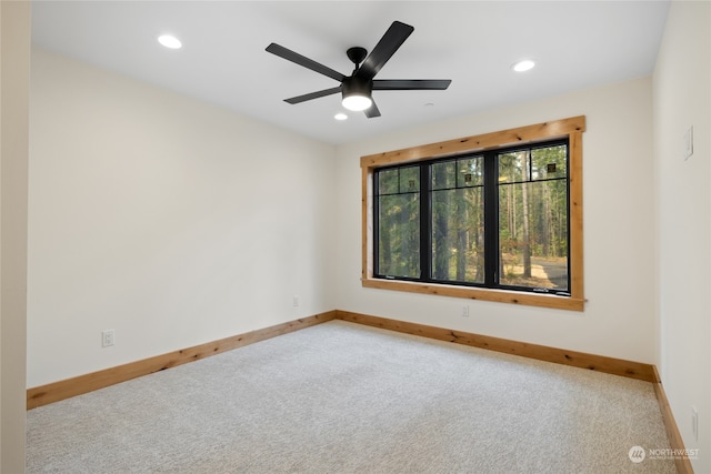 unfurnished room featuring carpet flooring and ceiling fan