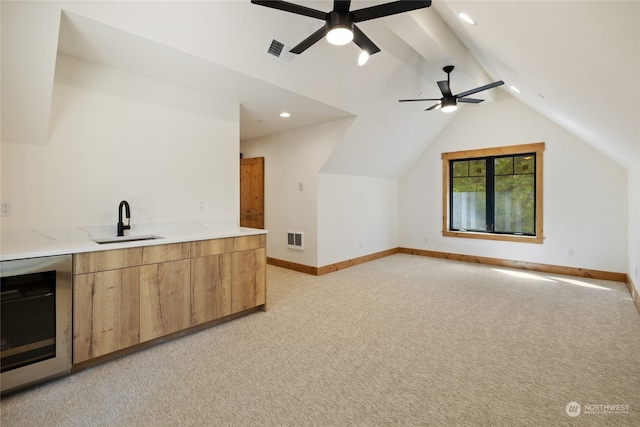 interior space with ceiling fan, sink, wine cooler, and light carpet