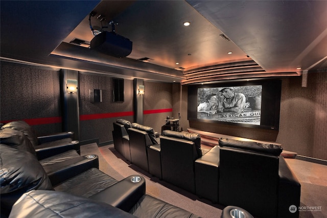 carpeted home theater featuring a tray ceiling