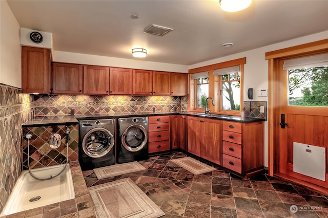 laundry room featuring sink and washing machine and clothes dryer