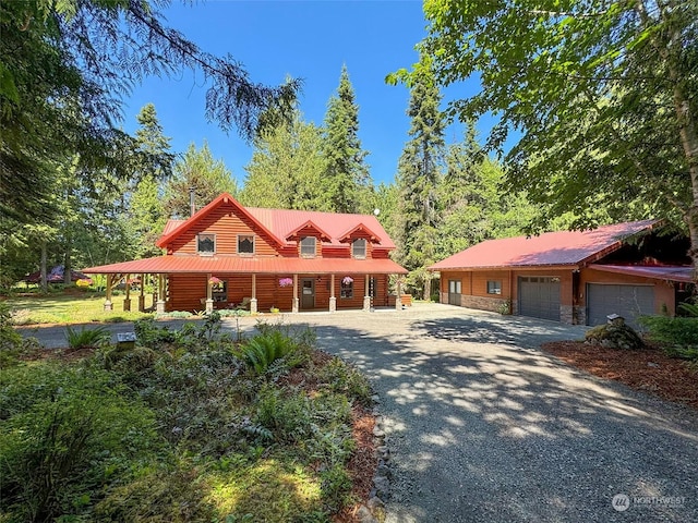 view of front facade with a garage and covered porch