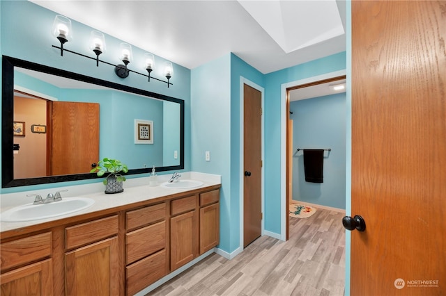 bathroom featuring hardwood / wood-style floors and vanity