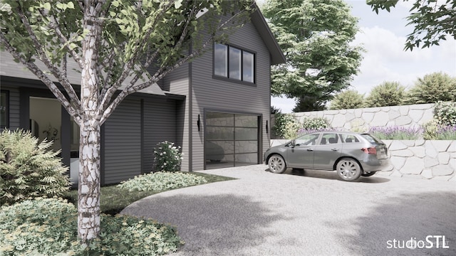 view of side of home featuring a garage