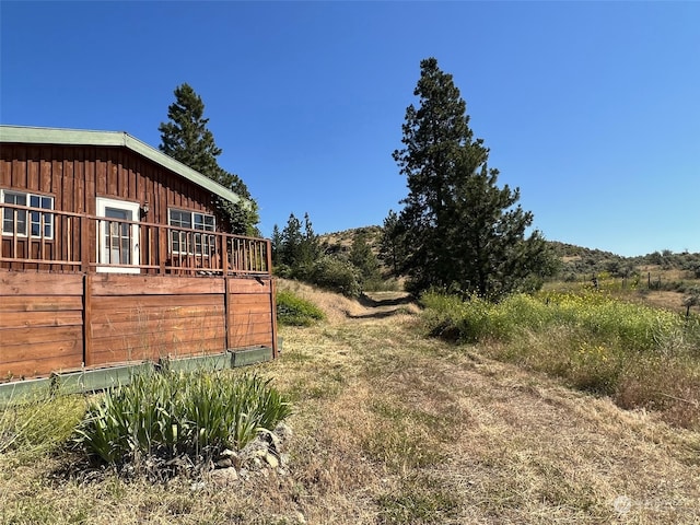 view of yard featuring a wooden deck