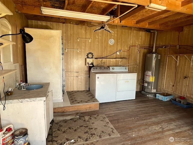 laundry area featuring dark hardwood / wood-style floors, hookup for a washing machine, washer and dryer, water heater, and sink