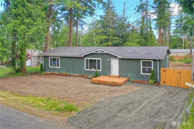 ranch-style house with a wooden deck