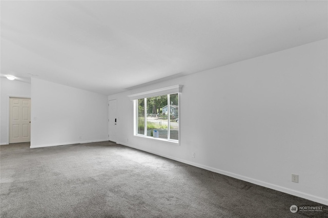 unfurnished room featuring carpet floors