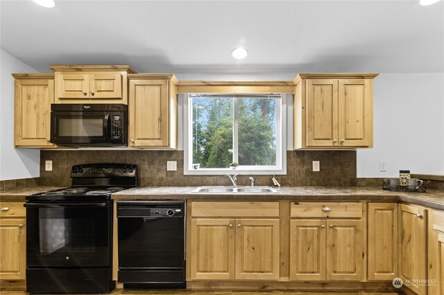 kitchen featuring tasteful backsplash, light brown cabinetry, sink, and black appliances