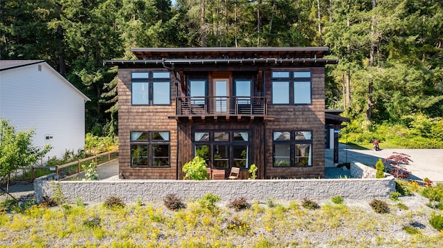 rear view of house with a balcony