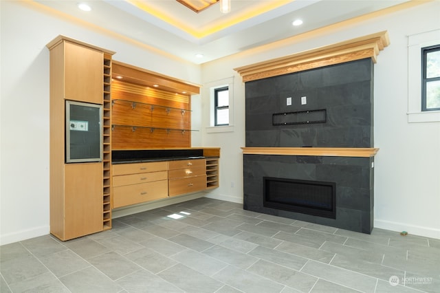 unfurnished living room with a healthy amount of sunlight and tile floors