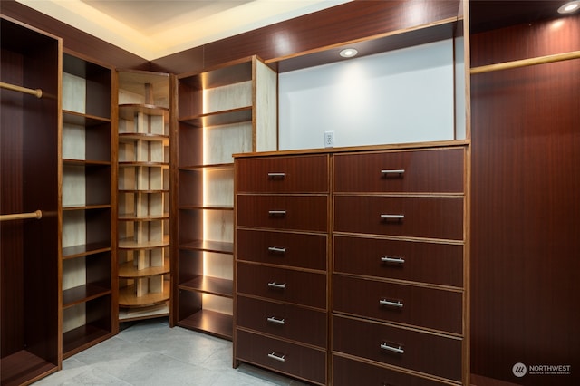 spacious closet featuring tile floors