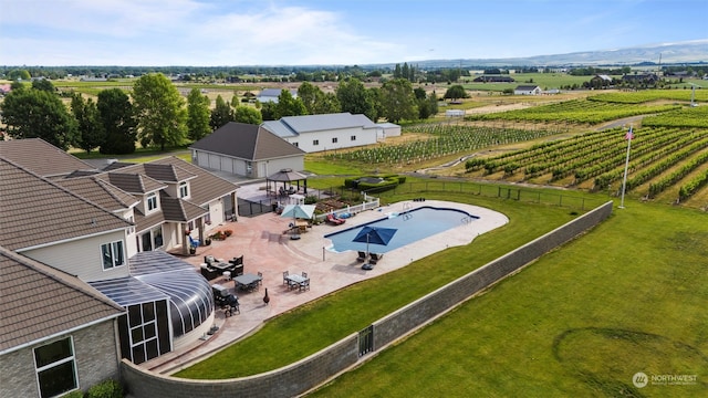 birds eye view of property featuring a rural view