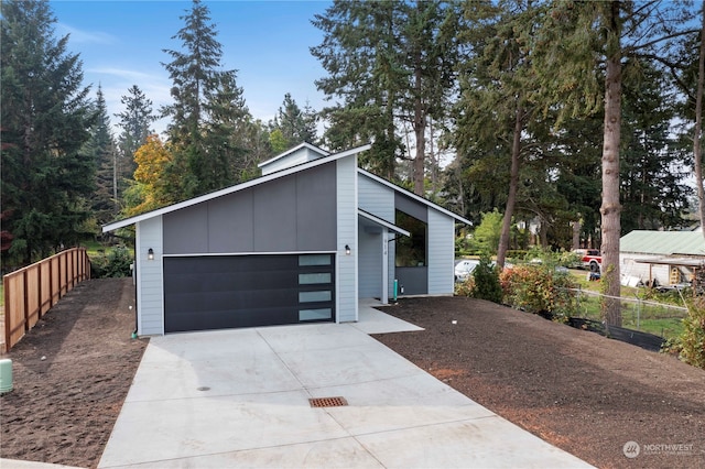 view of front facade featuring a garage and an outdoor structure