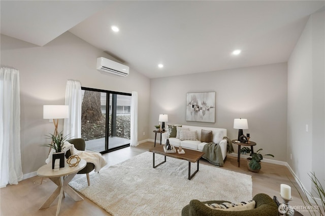 living area featuring recessed lighting, light wood-style floors, vaulted ceiling, a wall mounted air conditioner, and baseboards