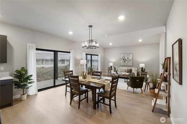 dining space with a healthy amount of sunlight, light wood finished floors, and recessed lighting