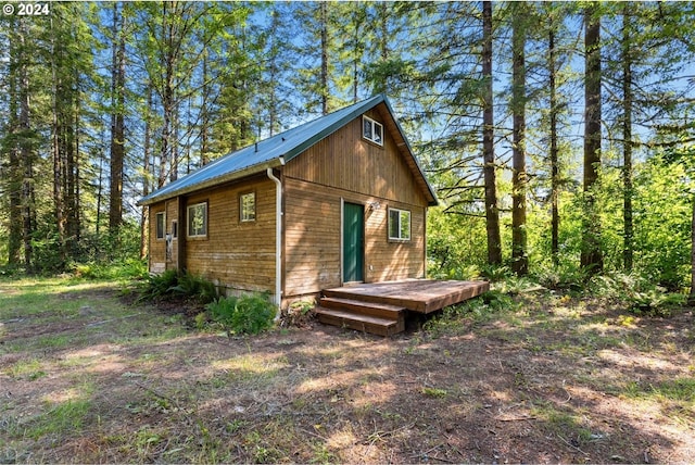 view of property exterior featuring a deck