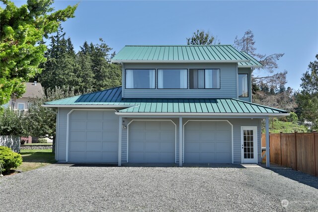 view of front of property featuring a garage