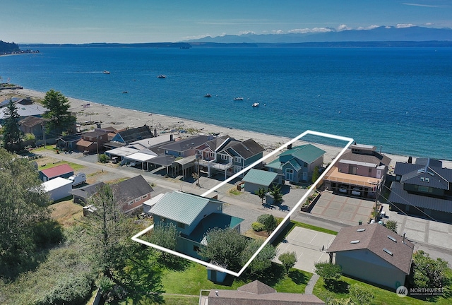 bird's eye view featuring a beach view and a water view