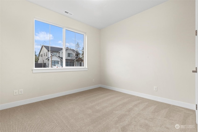 unfurnished room featuring carpet