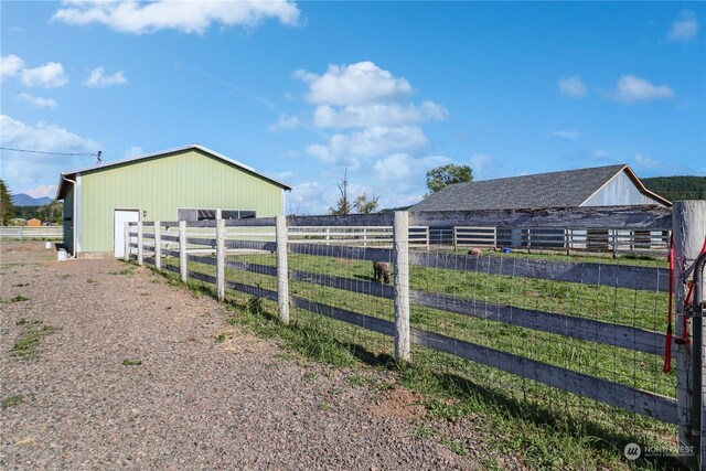 exterior space with a rural view and an outdoor structure